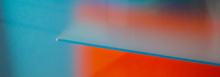 orange, blue glass artwork showcasing luminescent hues.