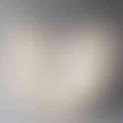 Abstract wood art sculpture with wood carvings reminscient of a geometric design.