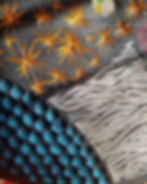 Carved wood artwork depictig stars, waves and a dotted pattern. Trending in wood art styles for 2023.