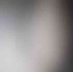 Abstract wood art sculptures placed next to one another.