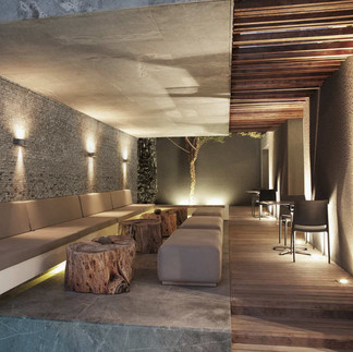 A wood art commission showing a feature wall of carved wood for a hotel project.