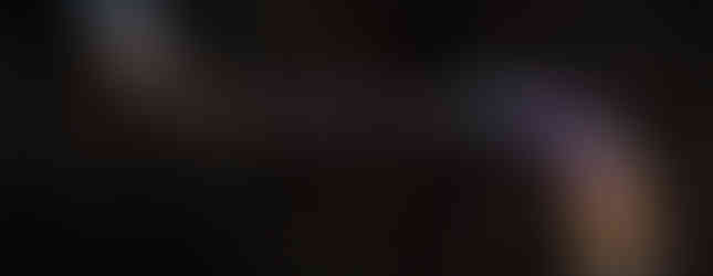 © Photo by Illuminated River Foundation - helicopter shot of leo villreal's light installation display in rainbow form over the several bridges of london at night lit with neon lights