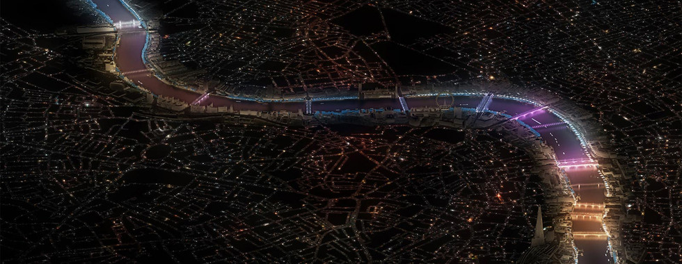 © Photo by Illuminated River Foundation - helicopter shot of leo villreal's light installation display in rainbow form over the several bridges of london at night lit with neon lights
