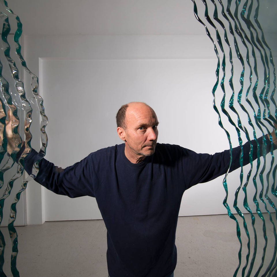 danny lane portrait photography handling his glass sculptures