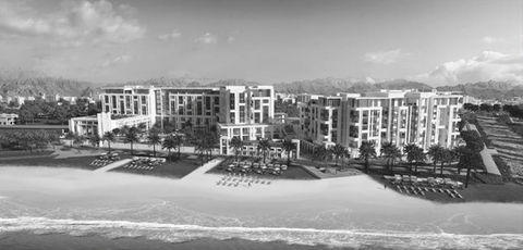 widepan shot in black and white of mandarin oriental's 5 star hotel in muscat, oman by the beach