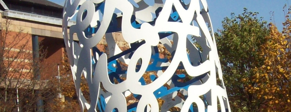 © Photo by Summonedbyfells showing a large contemporary art bottle made from thick metallic abstract interconnected fonts and letters