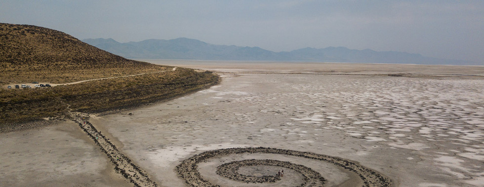 37. © Courtesy of Barcroft Media showing a spiral artwork set in the middle of the sand on a moody lit beach
