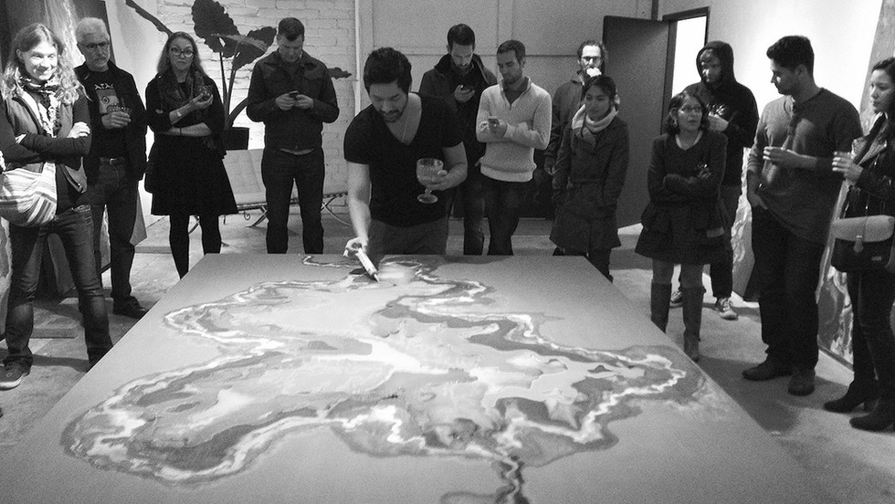 Private art collectors viewing a contemporary artist creating a contemporary artwork in oil