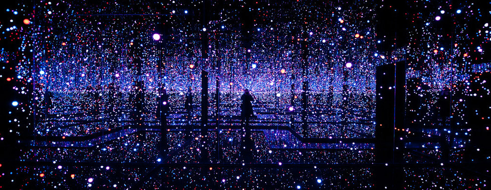 26. © Photo by Lux & Jourik showing an interior space in the dark lit by millions of altering neon lights made up of pinks and purples to imitate stars