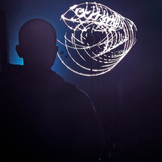 ONOTAK’s DAYDREAM V.6 (2021) is an audiovisual installation that projects dynamic light graphics on semi-transparent screens, visually distorting the surrounding space in an immersive experience. Part of an ongoing installation series, DAYDREAM, this iteration continues to create immaterial spaces that blur the lines between the virtual and reality. Visitors enter a dark room where nine aluminum frames are arranged in succession, each pinned with a see-through fabric. A projector casts geometric elements onto the screens, the light catching on the sheer layers but also passing through to generate duplicate visuals, while a contemplative soundscape is played. From afar, the floating graphics resemble a light sculpture but as participants get closer, the elements envelop them, making them feel as though their surrounding space is shifting constantly. The installation invites viewers to connect with the universal elements of sound and light, and explore their own interpretations amid distortions.