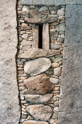 close up of rocks assembled to make a wall but in an artistic way, artist managed by artelier art advisory since 2012