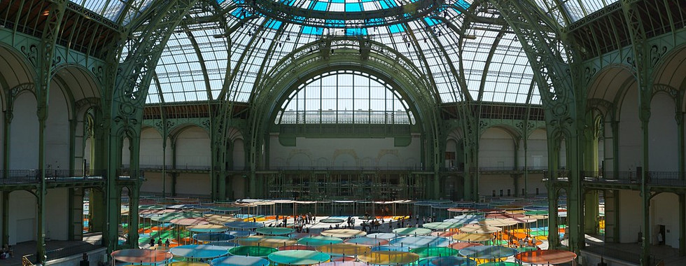 48. © Photo by Martin Heimburger showing the interior of a period building with a dome-like architecture with green steel infrastructure and large glass panel ceilings in daylight with an array of multicoloured circle shaped glass domes at the bottom on the floor