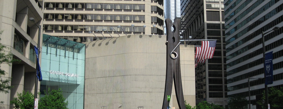 33. © Photo by Youtuber via Flickr showing a large clothing pin art installation in the middle of a corporate space of buildings in Philadelphia