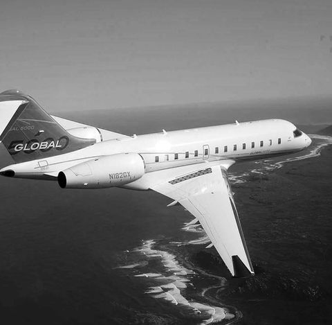 Outdoor image in black and white of an aircraft in the sky that had artwork commissioned by Artelier called BOMBARDIER GLOBAL 5000 by AeroVisto, Switzerland
