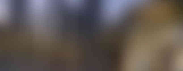 20. © Photo by Chironius showing a steel plated contemporary abstract large heart in the middle of an urban square with lots of people walking around it at moonlight