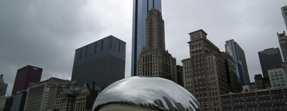 31. © Photo by Gustavo Thomas showing a large shiny metallic abstract blob as an art installation in the middle of chicago