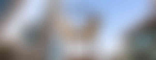 22. © Courtesy of Timeout showing a pair of gold wings perfectly in line with the tallest building in Dubai