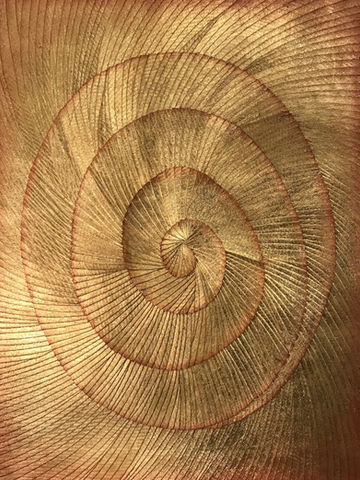 woven golden thread circular spiral piece up close in detail, a piece commissioned by dubai-based art advisors artelier art consultancy