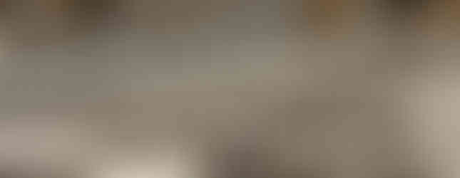 46. © Photo by Thierry via Flickr showing a liner assortment of black and white stripe cylinders of varying heights in the rain in the middle of an outdoor space