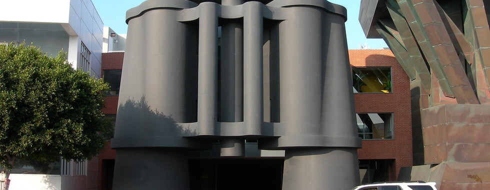 36. © Photo by Musiquegirl via Flickr showing a giant pair of binoculars as part of a contemporary art exhibition with a white SUV parked next to it