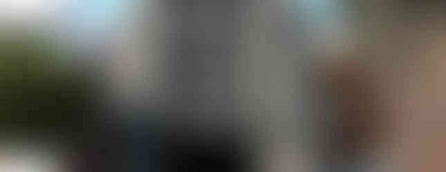 36. © Photo by Musiquegirl via Flickr showing a giant pair of binoculars as part of a contemporary art exhibition with a white SUV parked next to it