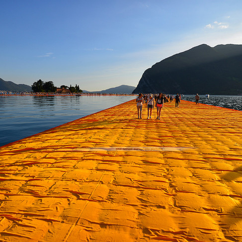 A close-up of the orange platform, appearing pillow-like upon the water, forming creased grids and lines.
