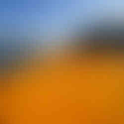 A close-up of the orange platform, appearing pillow-like upon the water, forming creased grids and lines.