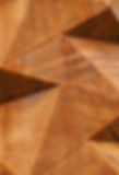 close up image of patina metals in a geometric, triangular style with different angles and shapes