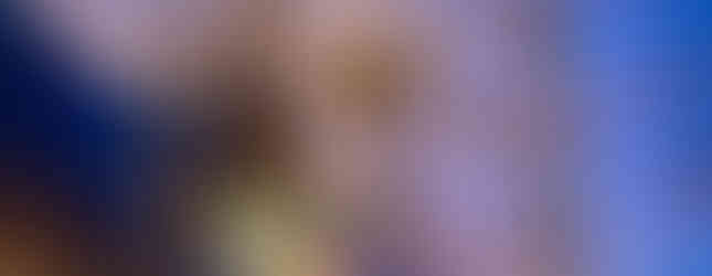 25. © Photo by Joshua Mellin showing a spider light art installation well above human height outside a contemporart art architectural building in evening light