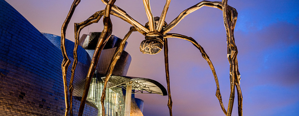 25. © Photo by Joshua Mellin showing a spider light art installation well above human height outside a contemporart art architectural building in evening light