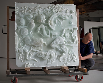 danny lane's glass sculpted on a transporting device featuring the artist himself