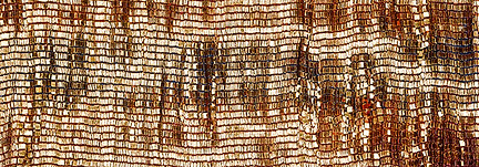 gold and orange hued artwork with light reflecting off to give the impression of a graph-like artwork.