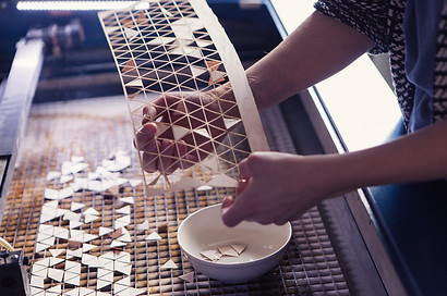 Elisa strozyk working on a new commissioned using geometric, wooden and textile segments