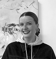 Artelier team member and curator Ella Forster in black and white