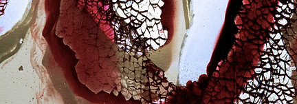 red mixed-media work with burnt orange hues