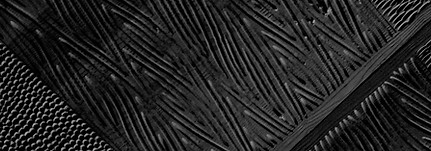 black and white wood artwork in triangular form with white detailing.