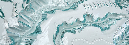 light and dark blue glass artwork in abstract forms