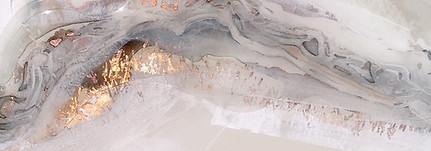 white, light grey and dark grey artwork with gold leaf detail on the left side.