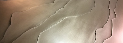 gold leaf abstract 3d sculputre, with gold ridges running through the artwork towards the edge of the image.