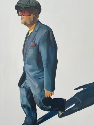 This fine art to invest in piece by Emilia Momen is of a middle-aged man walking down the street, wearing a blue tuxedo and aviator sunglasses that cover most of his face. Background is white and shadow is prominent.