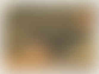 UK based artist creates a abstract green, orane and yellow artwork reminscient of a landscape.