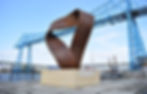 This emerging British artists work is a public art sculpture in Middlesborough. It shows a large steel sculpture like a curved ribbon, expressing unity.