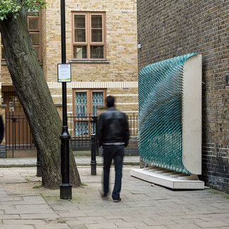 Artelier public art consultancy commissioned Giles Miller to create a blue disc artwork set in a rectangular format in London