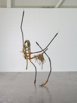 A contemporary art sculpture showcasing an abstract figure made from rope and steel by a emerging British artist, Dominique White.