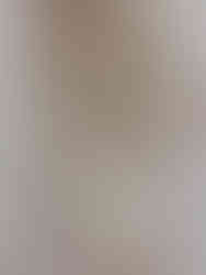 A close-up of a contemporary artwork in plaster and wood ready for art investment.