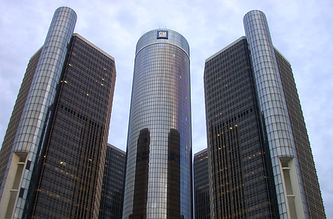 outsid of GM corporate glass building in a city landscape
