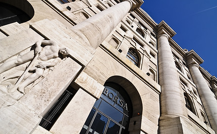 outside picture of a historic building with engraving of human figure 