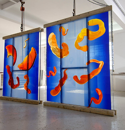 a job commissioned for danny lane featured a large scale glass artwork installation under artelier with a unique wooden frame holding both glass artworks, with a blue base and red organic fluid shapes layered on top