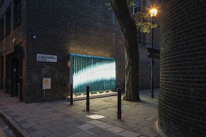 Giles Miller Studio Billboards exampling artelier's service for presentation and installation at clerkenwell close in london at nighttime on a side street 2