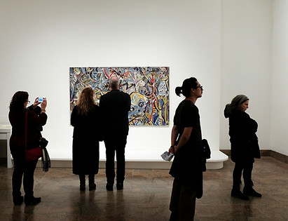 gallery exhibition with people in it